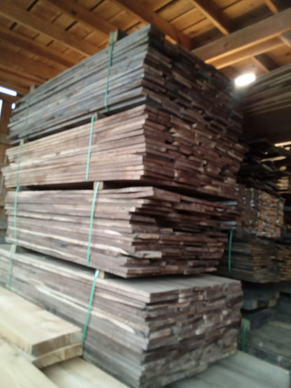 Reclaimed black walnut lumber stacks