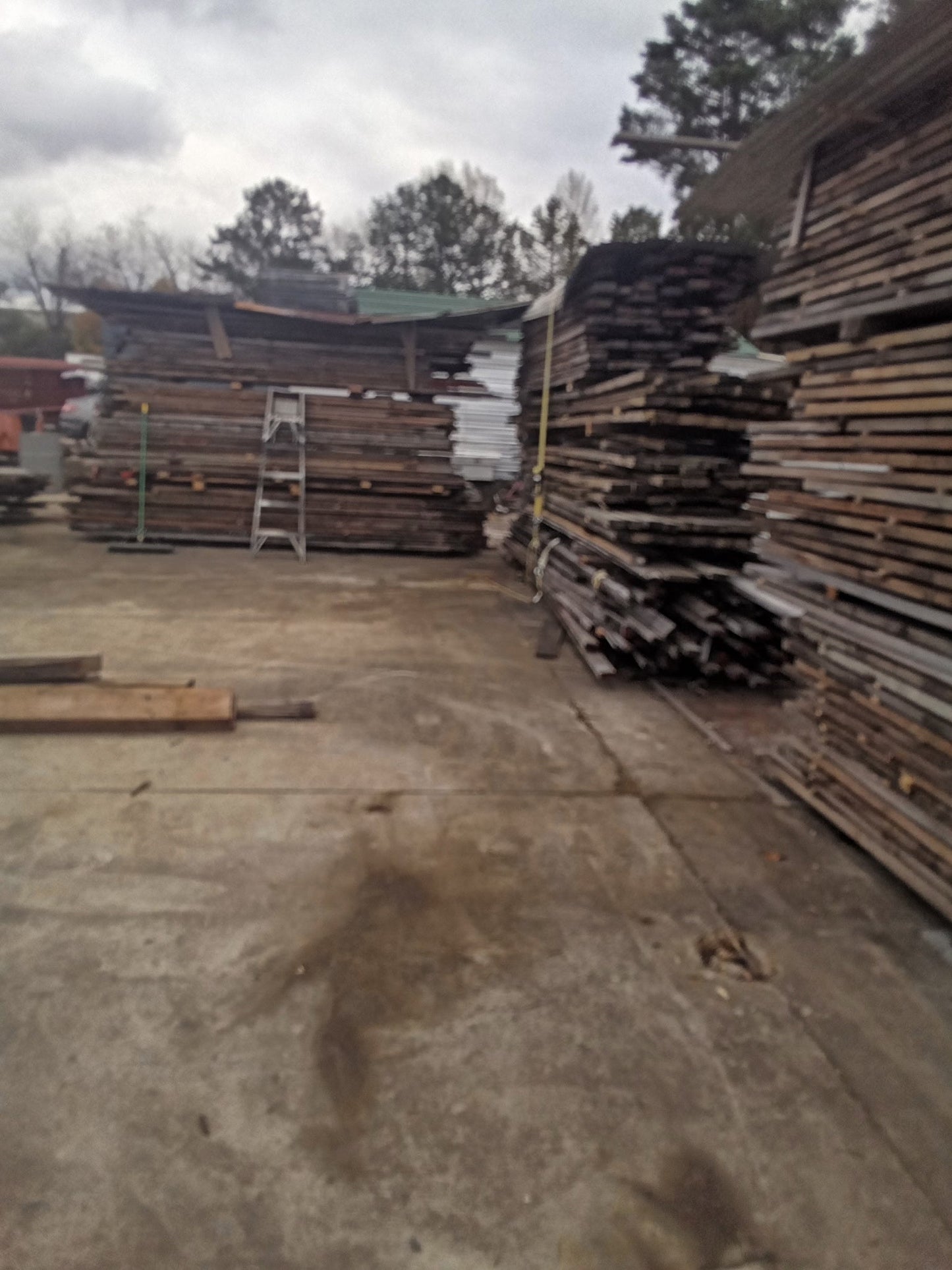 Reclaimed hemlock lumber stacks bulk