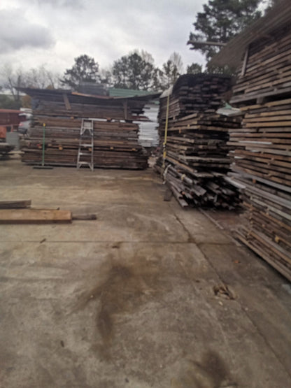 Reclaimed hemlock lumber stacks bulk