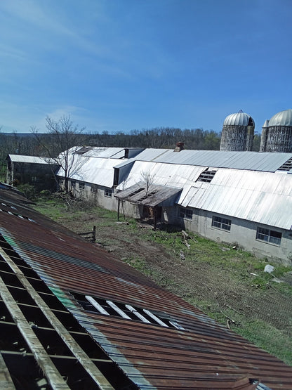 Reclaimed aluminum corrugated sheets stacked