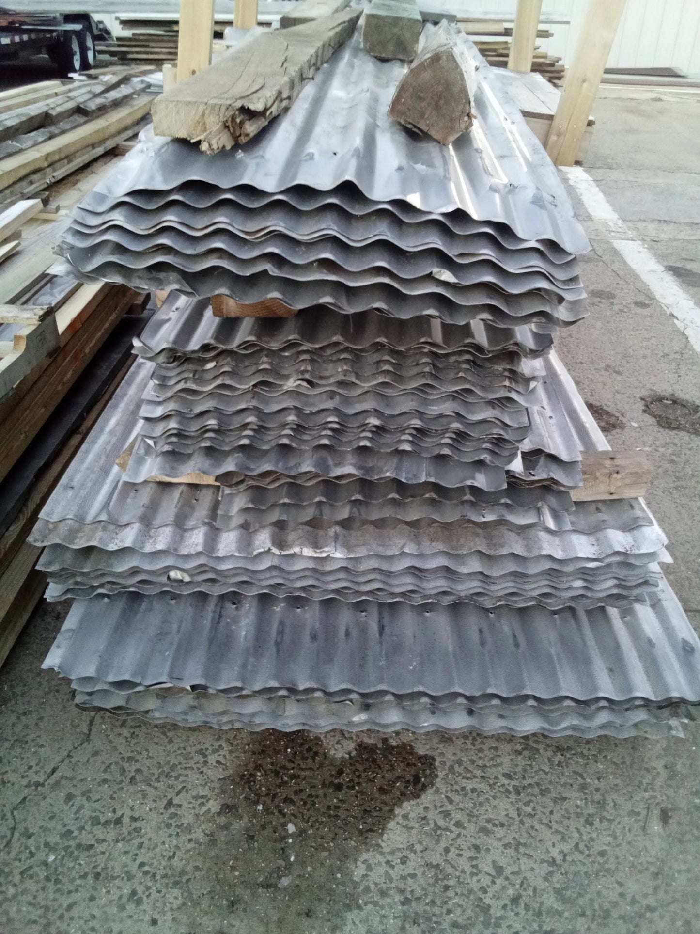 Reclaimed corrugated aluminum roofing sheets from barn salvage