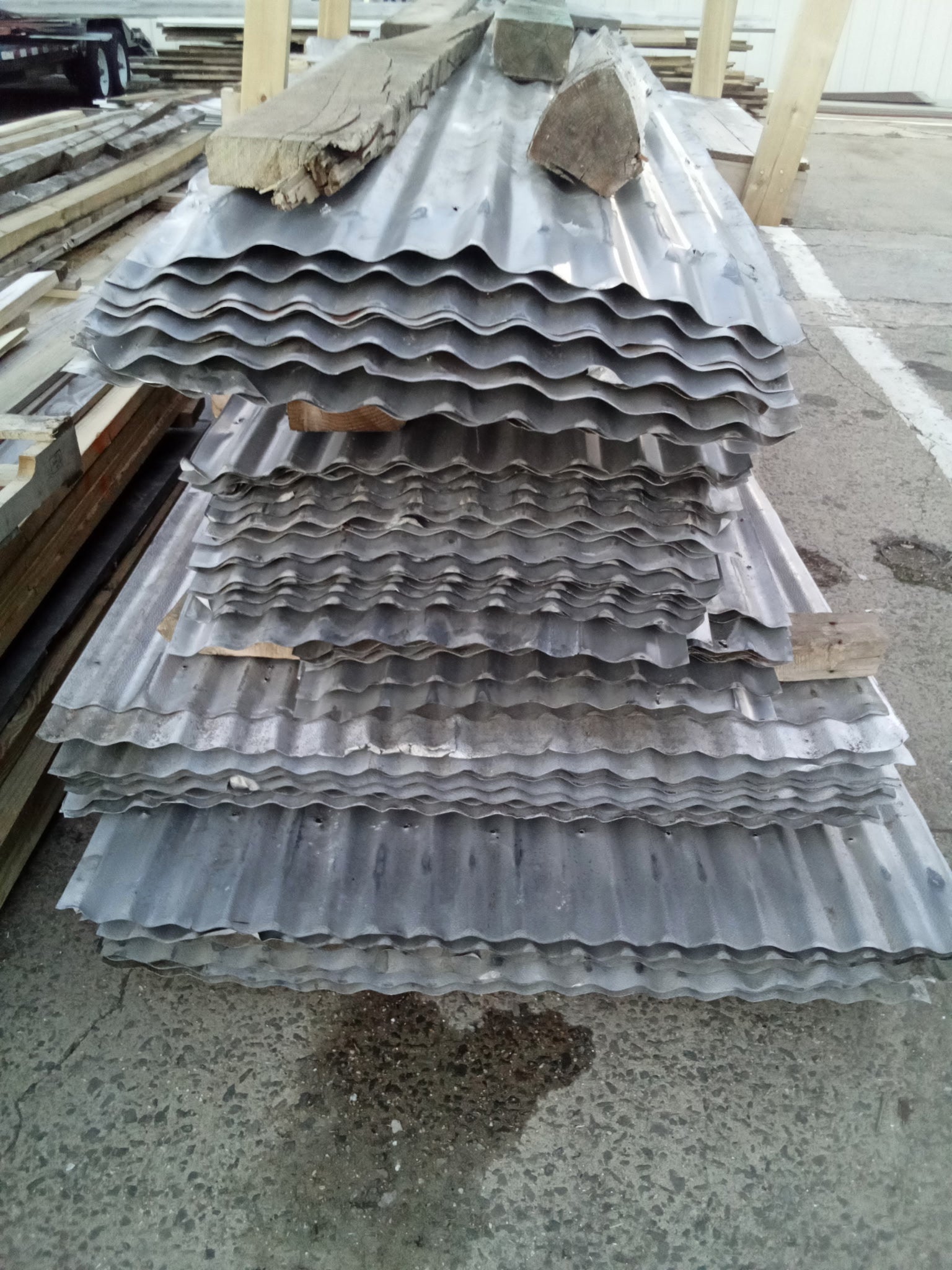 Reclaimed corrugated aluminum roofing sheets from barn salvage