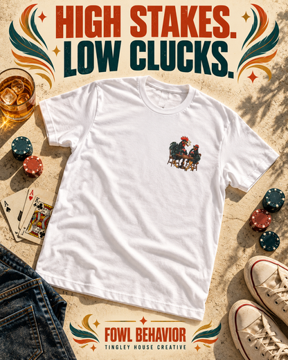 High Stakes, Low Clucks rooster T-shirt with small left-chest artwork, styled in a bold vintage flat lay.