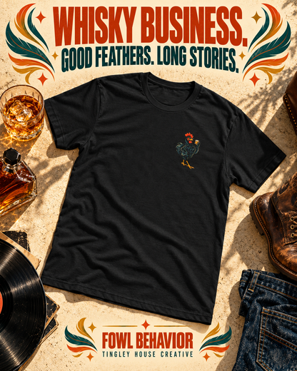 Whisky Business rooster T-shirt with small left-chest artwork, styled in a bold vintage flat lay.